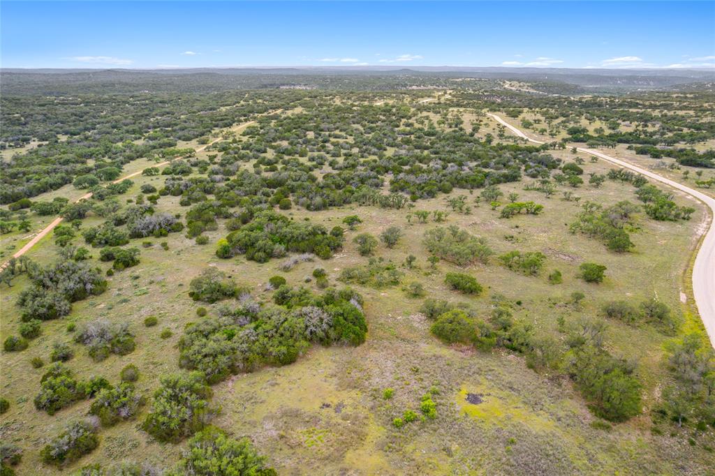 S3660 Seven Springs Ranch Junction Junction, TX 76849 - Photo 12 of 27 an aerial view of residential houses with outdoor space
