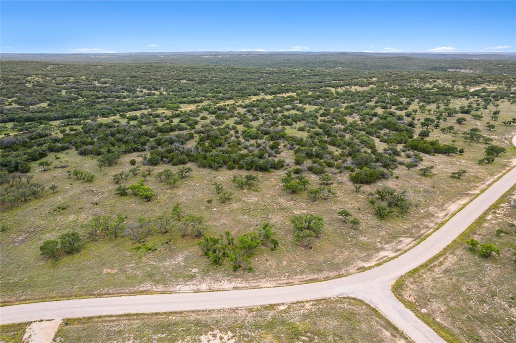 S3660 Seven Springs Ranch Junction Junction, TX 76849 - Photo 13 of 27 an aerial view of residential houses with outdoor space
