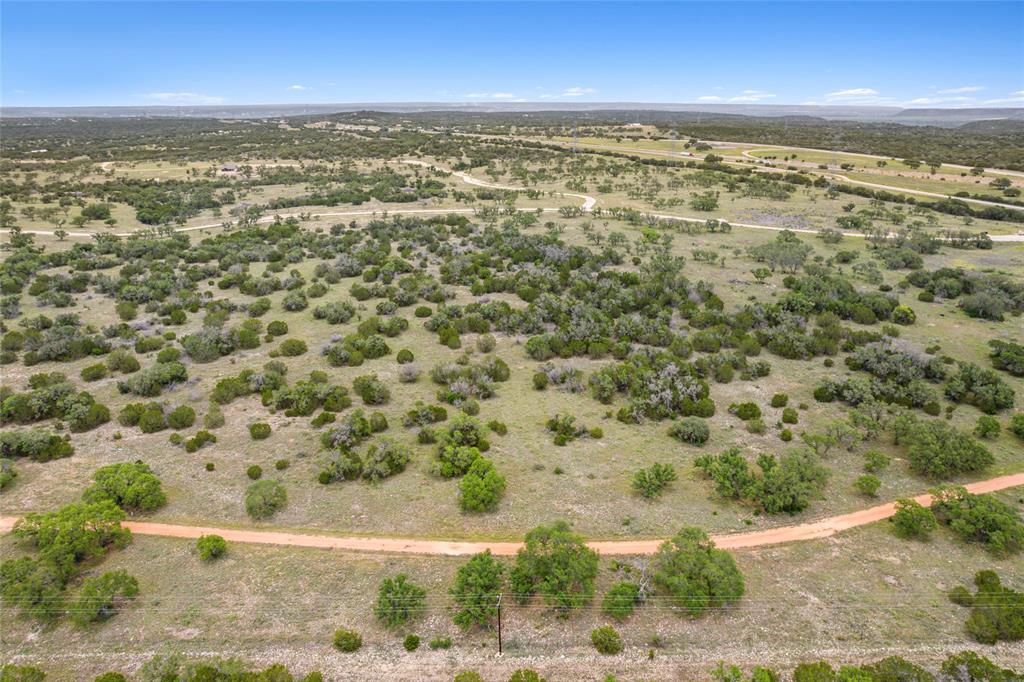 S3660 Seven Springs Ranch Junction Junction, TX 76849 - Photo 17 of 27 an aerial view of residential houses with outdoor space
