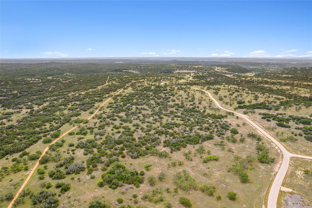 S3660 Seven Springs Ranch Junction Junction, TX 76849 - Photo 22 of 27 an aerial view of residential houses with outdoor space
