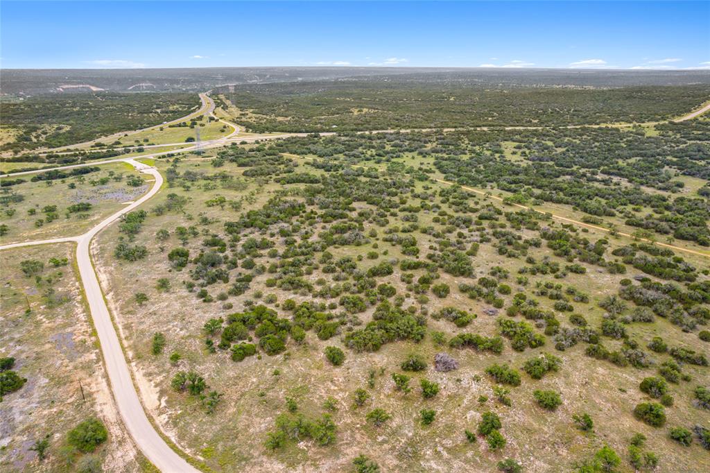 S3660 Seven Springs Ranch Junction Junction, TX 76849 - Photo 25 of 27 an aerial view of residential houses with outdoor space