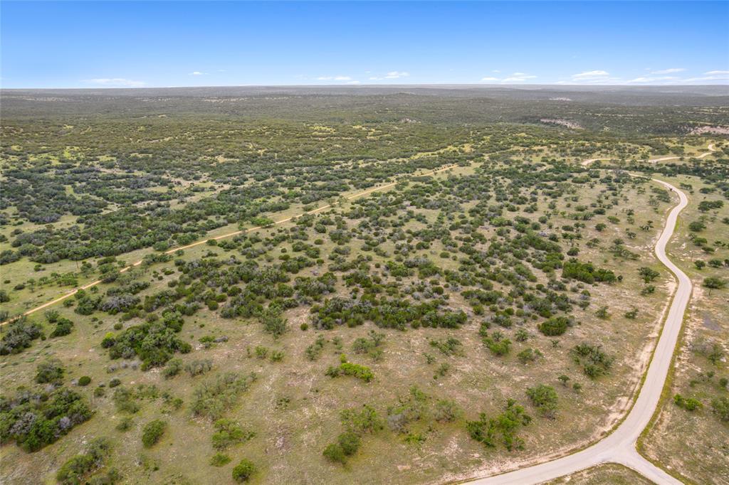 S3660 Seven Springs Ranch Junction Junction, TX 76849 - Photo 4 of 27 an aerial view of residential houses with outdoor space