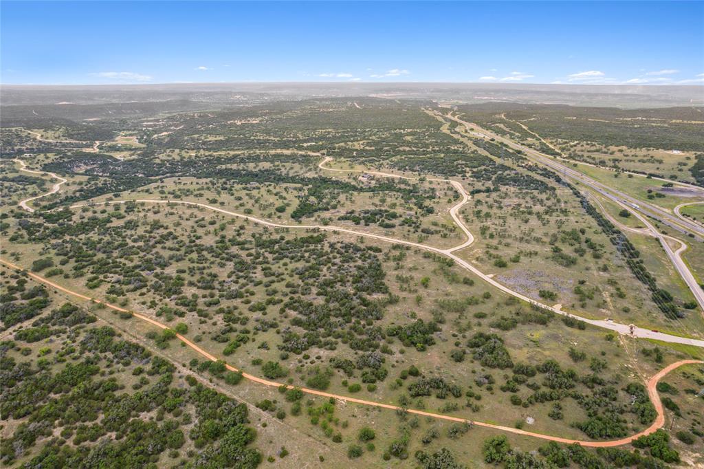 S3660 Seven Springs Ranch Junction Junction, TX 76849 - Photo 10 of 27 an aerial view of residential houses with outdoor space