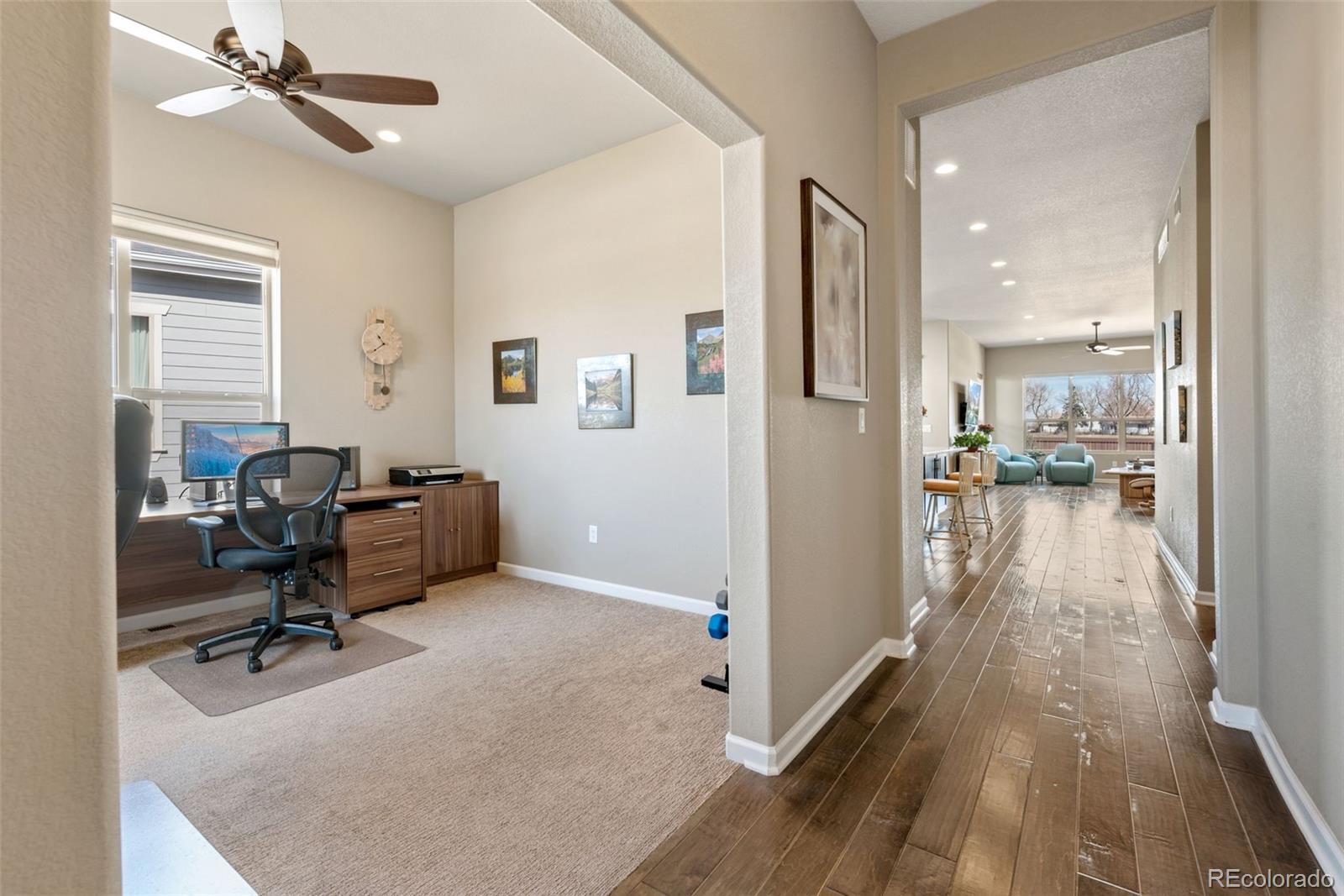 3044 Zephyr Road Fort Collins, CO 80528 - Photo 4 of 30 a view of a workspace with furniture and a window