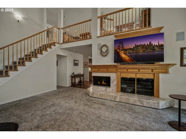 a view of a fireplace with a hallway