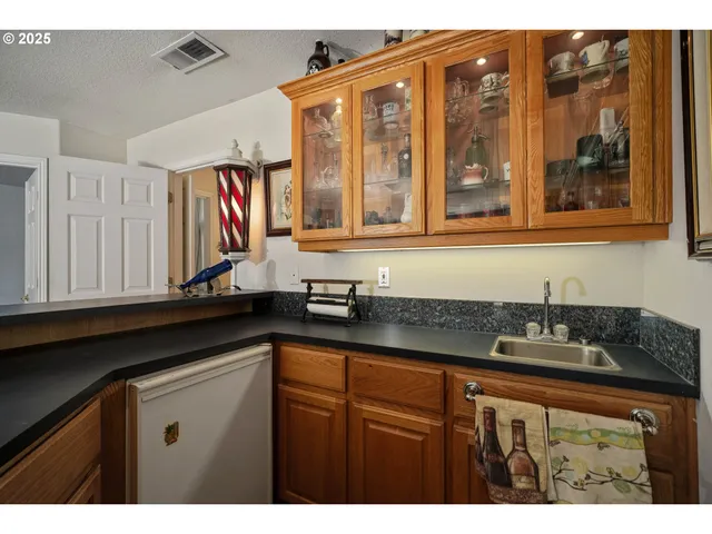 a bedroom with a bed and a flat tv screen