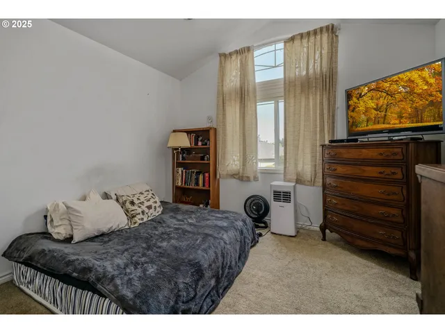 a view of room with a flat screen tv