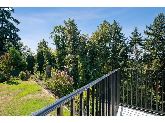 a lobby with furniture and potted plants