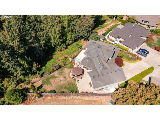 an aerial view of house with yard and mountain view