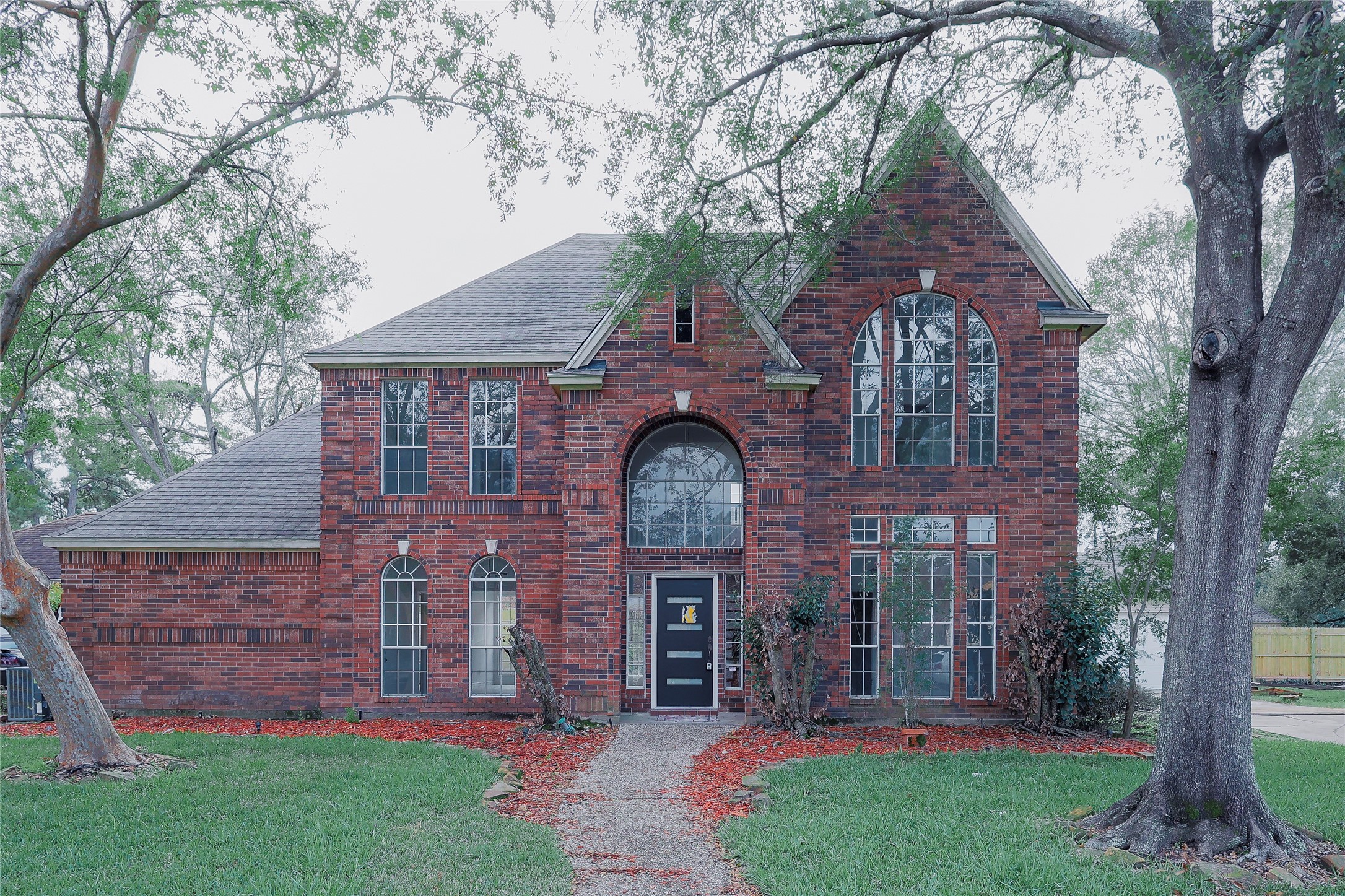 front view of a house with a yard