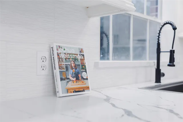 a view of a hallway with seating area