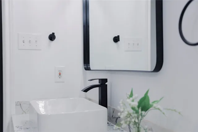a bathroom with a toilet sink and shower