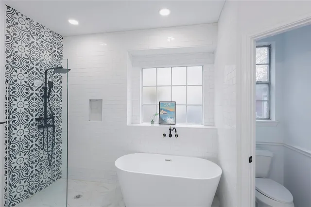a bathroom with a white bath tub