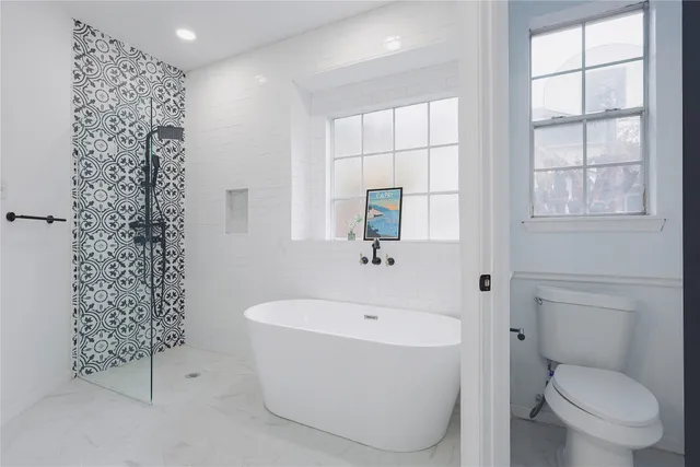 a bathroom with a double vanity sink mirror and shower