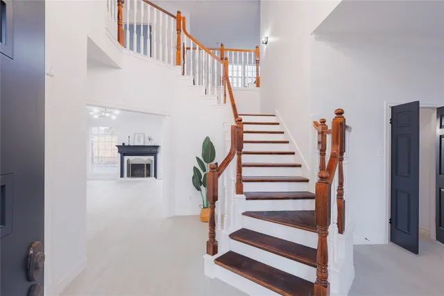a view of staircase with white walls