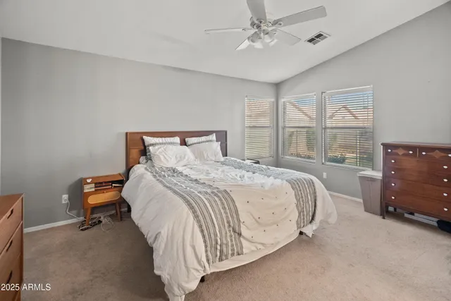 a bed room with a bed and a dresser