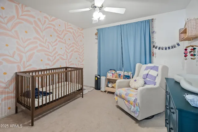 a bedroom with furniture and a chandelier
