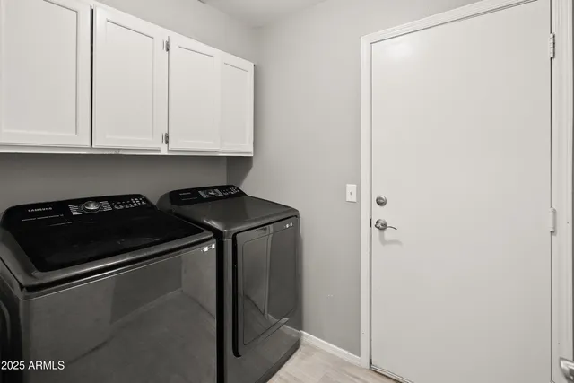 a close view of a utility room with washer and dryer