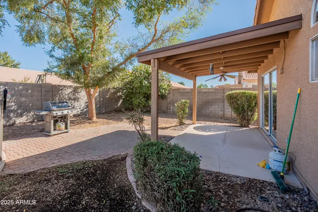 a view of backyard with patio