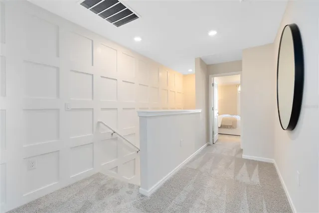 a view of a room with cabinet and mirrors