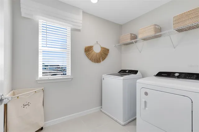 a view of storage and utility room with washer and dryer