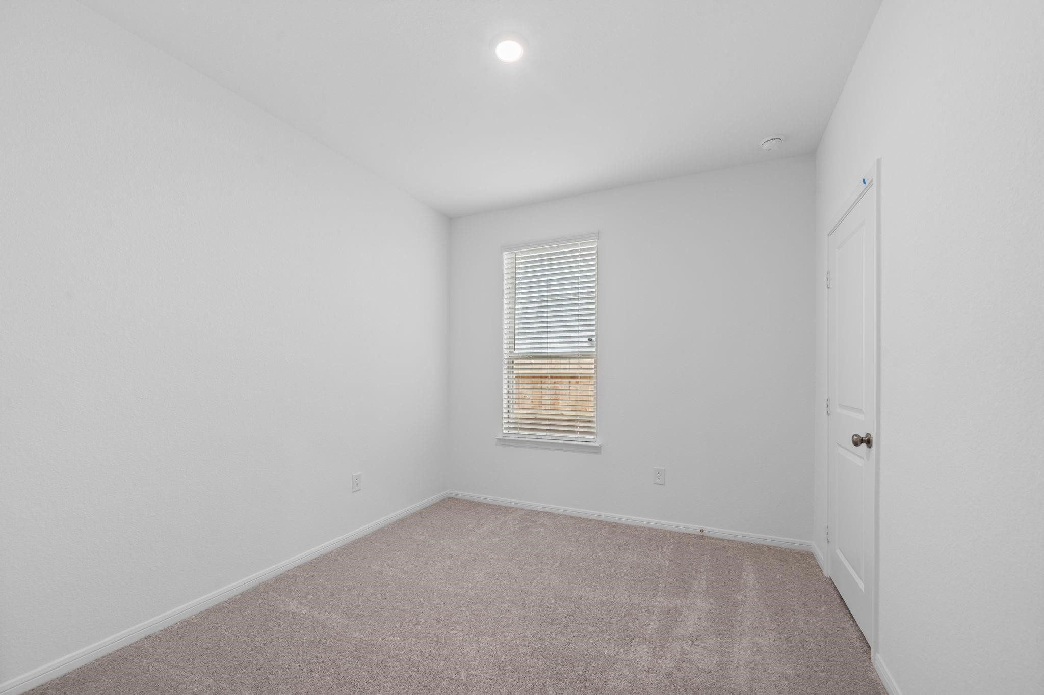 9015 Cedar Cres Drive Baytown, TX 77521 - Photo 16 of 26 an empty room with a window