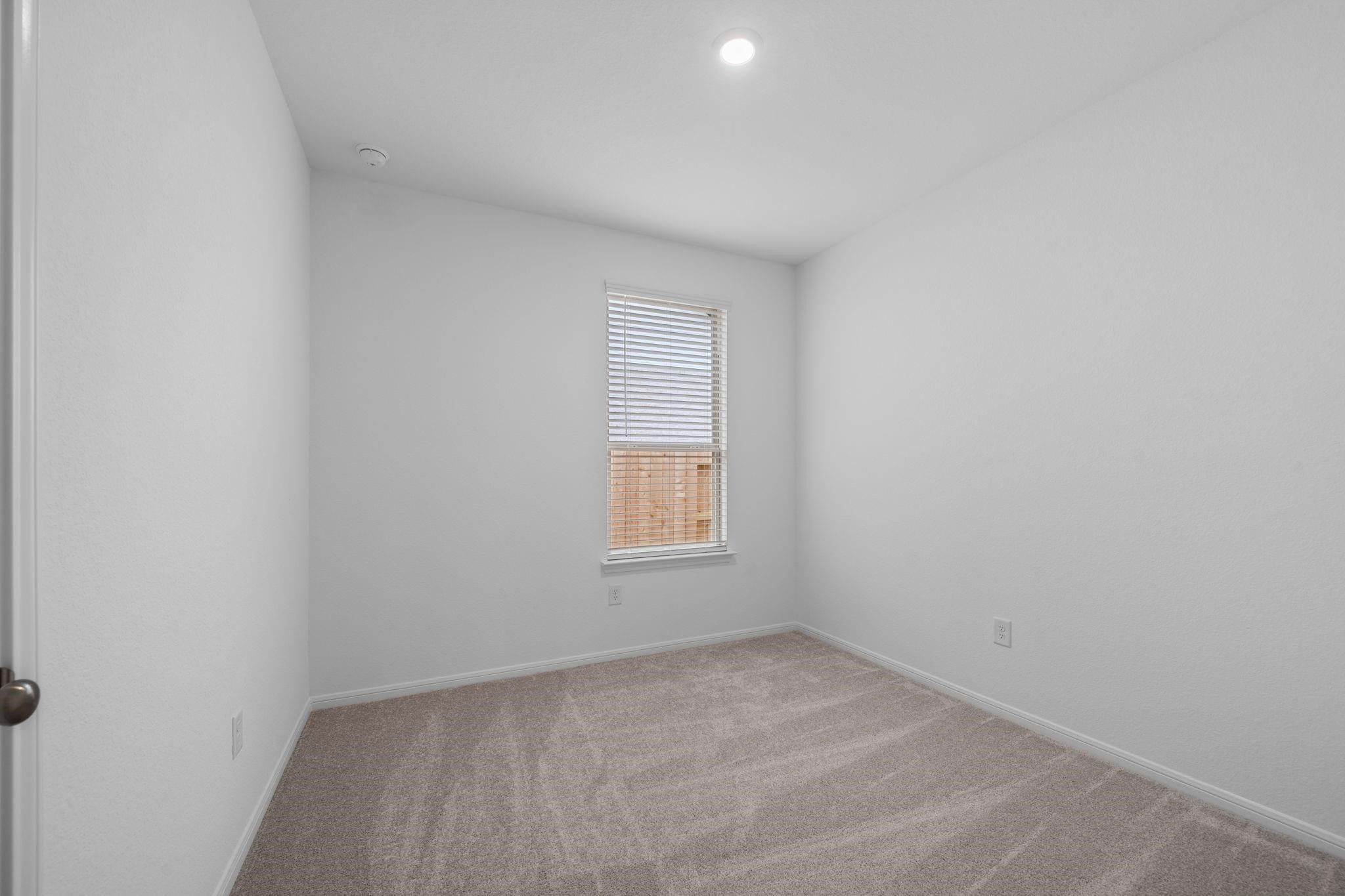 9015 Cedar Cres Drive Baytown, TX 77521 - Photo 17 of 26 an empty room with a window