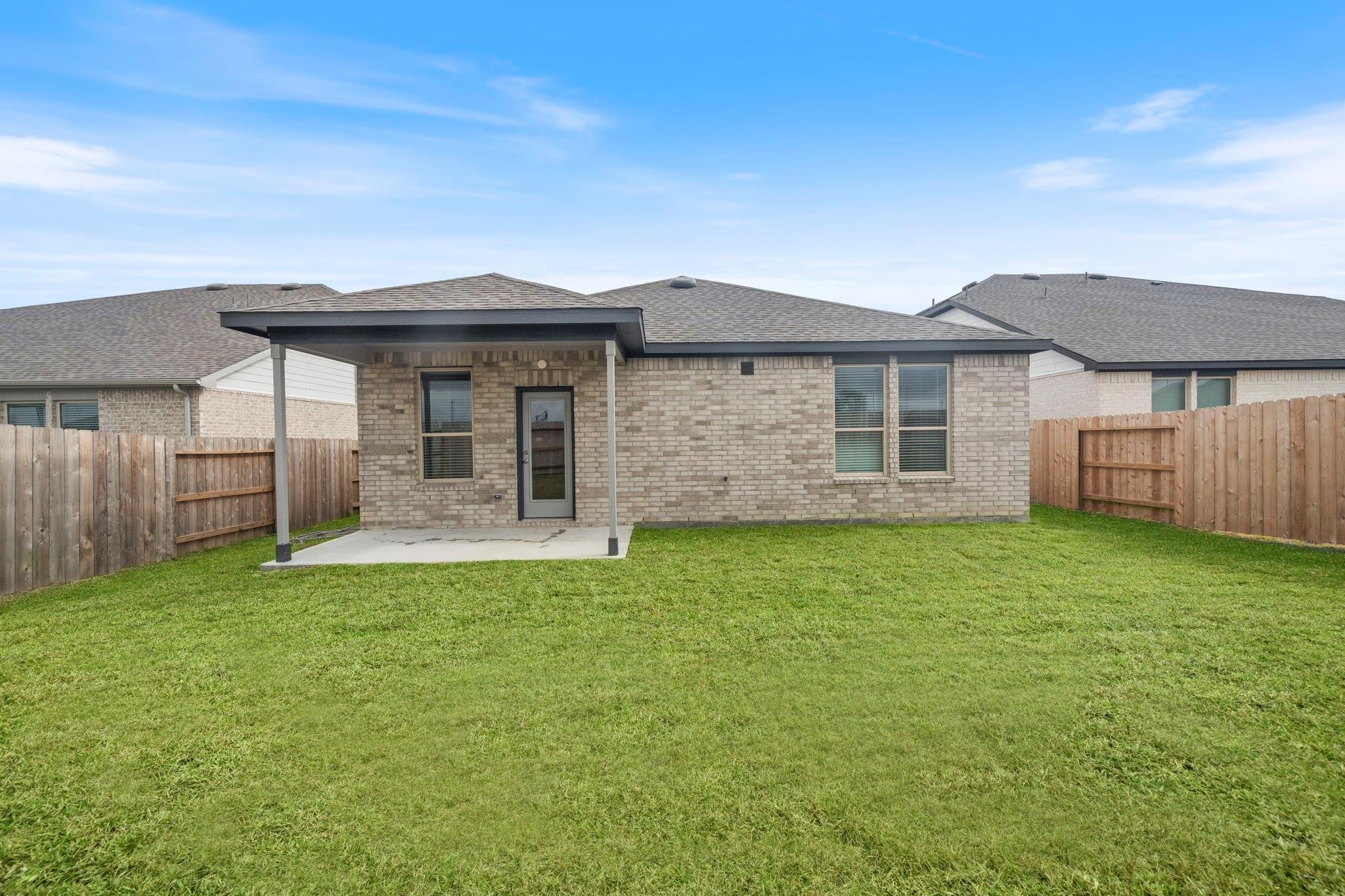 9015 Cedar Cres Drive Baytown, TX 77521 - Photo 20 of 26 a front view of a house with a garden