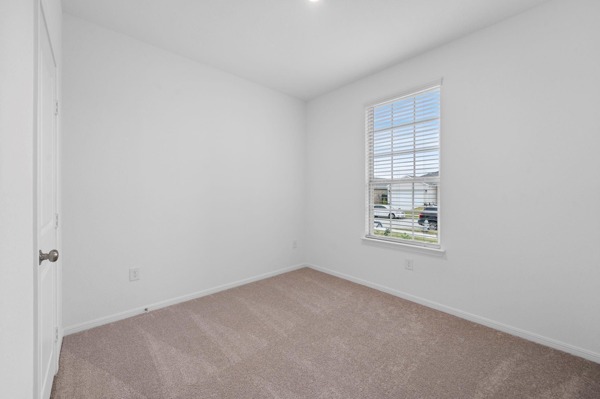 9015 Cedar Cres Drive Baytown, TX 77521 - Photo 10 of 26 an empty room with windows