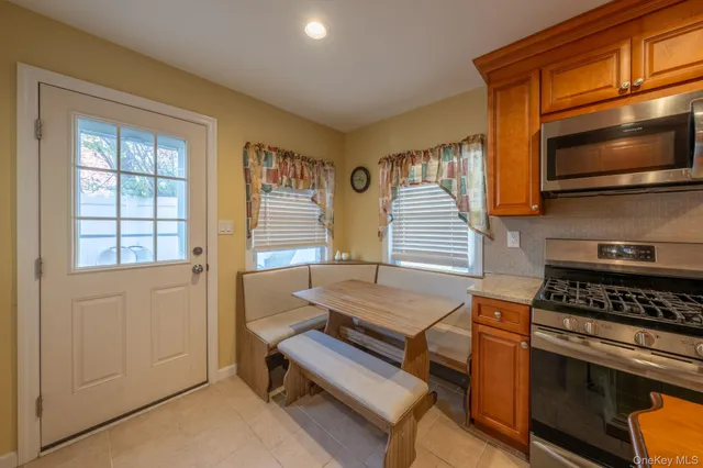 a kitchen that has a stove and a microwave
