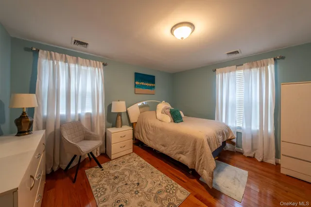 a bed room with a bed and a lamp