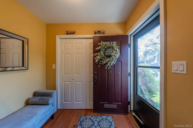 a view of entryway with wooden floor