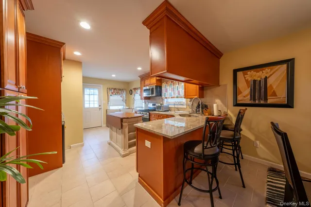 a kitchen with a table and chairs in it