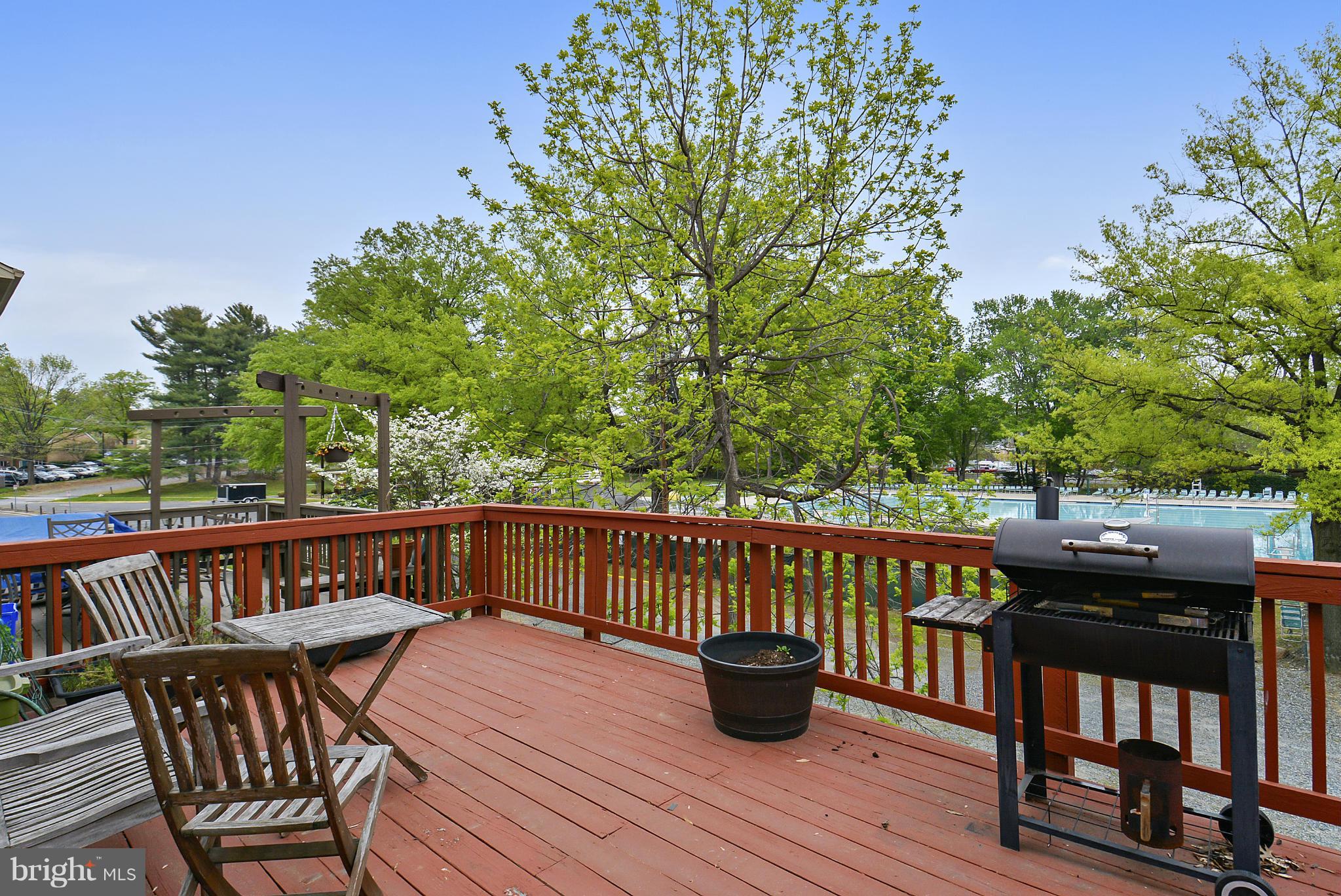 3841 Ferrara Drive Silver Spring, MD 20906 - Photo 14 of 30 a view of balcony with furniture and trees in the background