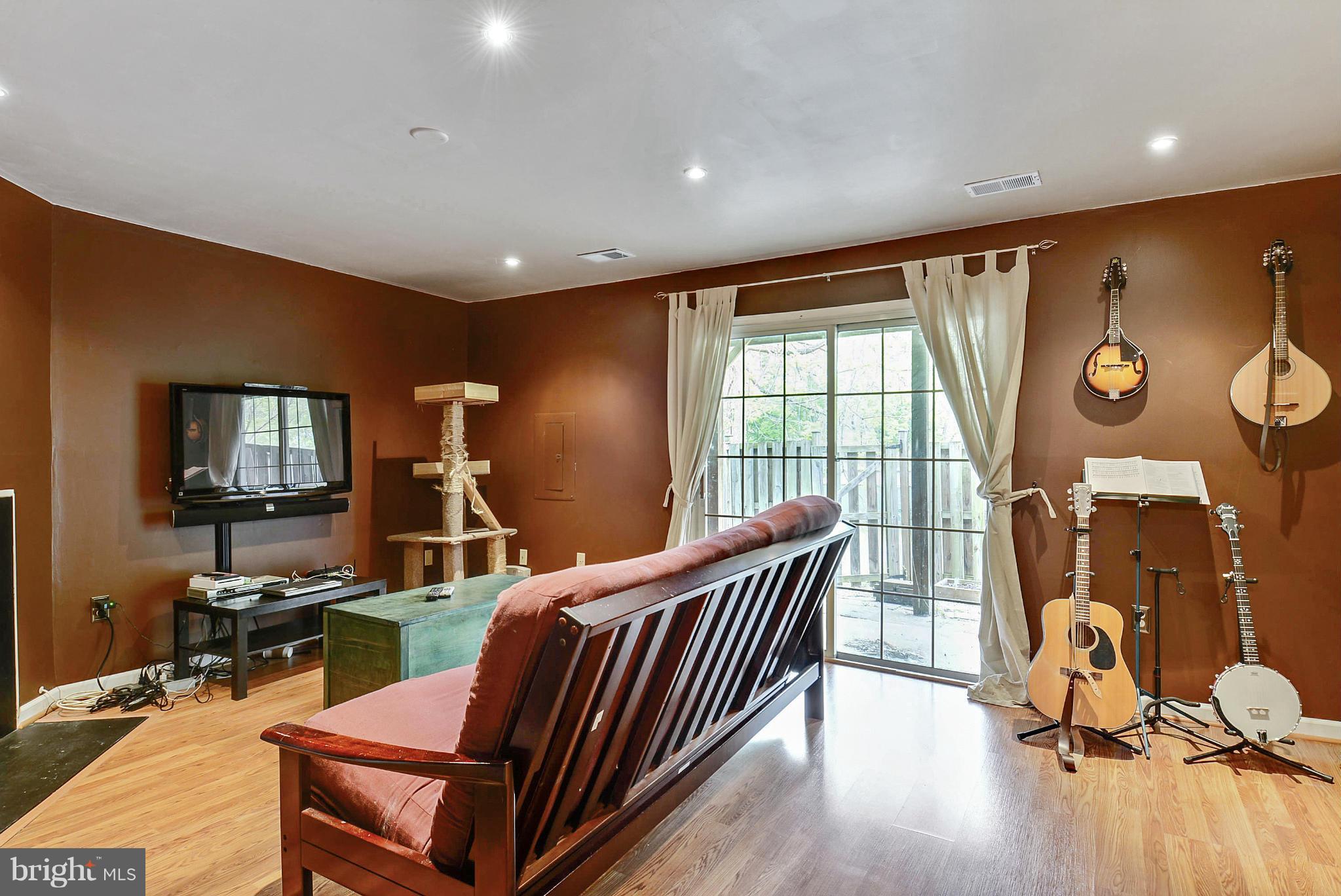 3841 Ferrara Drive Silver Spring, MD 20906 - Photo 18 of 30 a livingroom with furniture and a flat screen tv