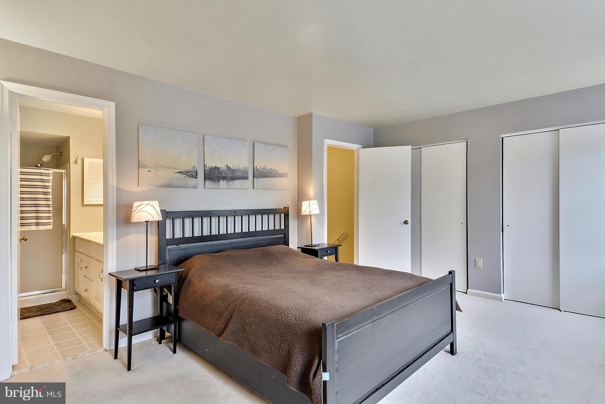 3841 Ferrara Drive Silver Spring, MD 20906 - Photo 20 of 30 a bedroom with a bed window and a table in it