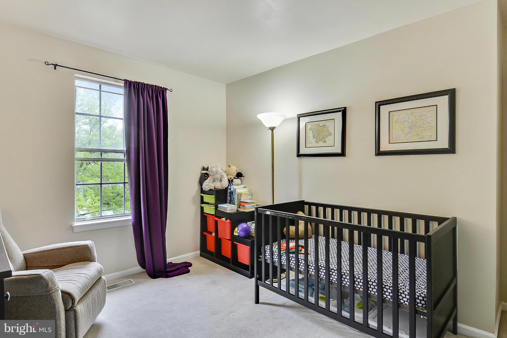 3841 Ferrara Drive Silver Spring, MD 20906 - Photo 28 of 30 a bedroom with a bed and a window
