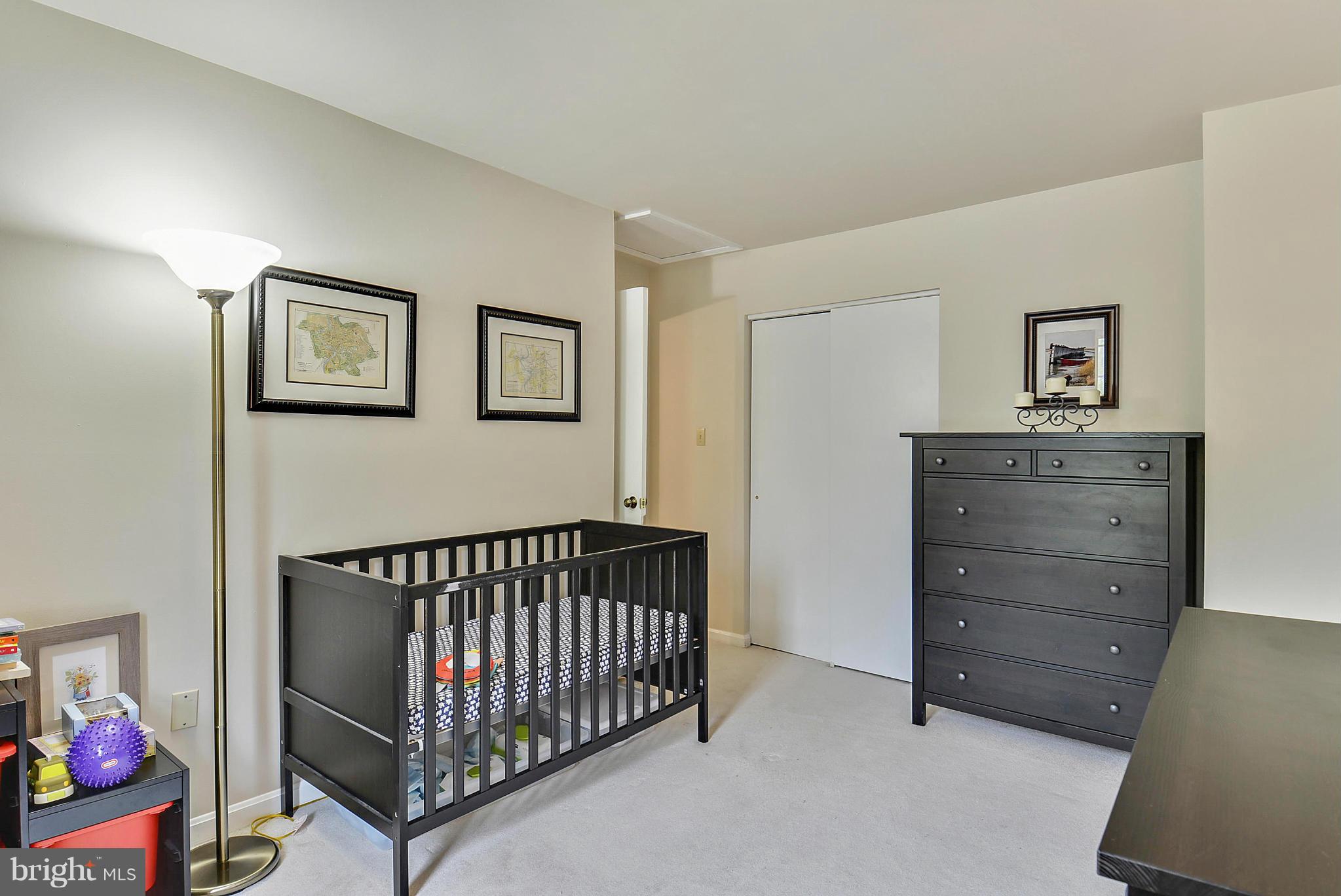 3841 Ferrara Drive Silver Spring, MD 20906 - Photo 29 of 30 a view of a livingroom with a baby crib