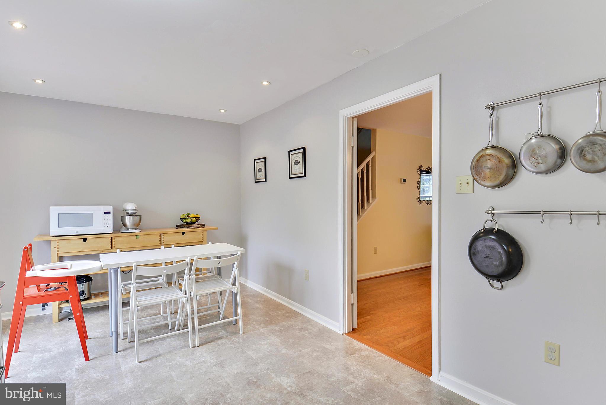 3841 Ferrara Drive Silver Spring, MD 20906 - Photo 6 of 30 a room with a table and chairs