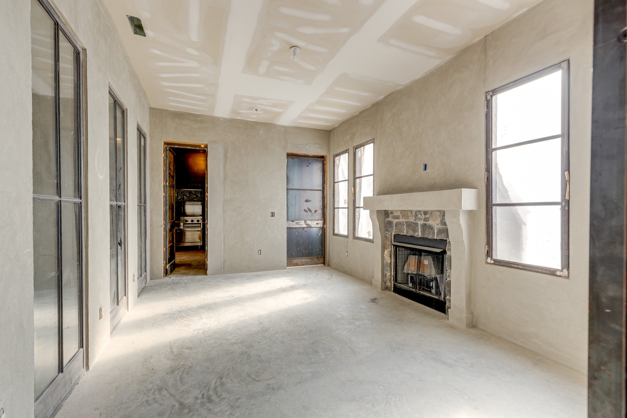 3235 Boyd Mill Pike Franklin, TN 37064 - Photo 14 of 68 an empty room with windows and a fireplace