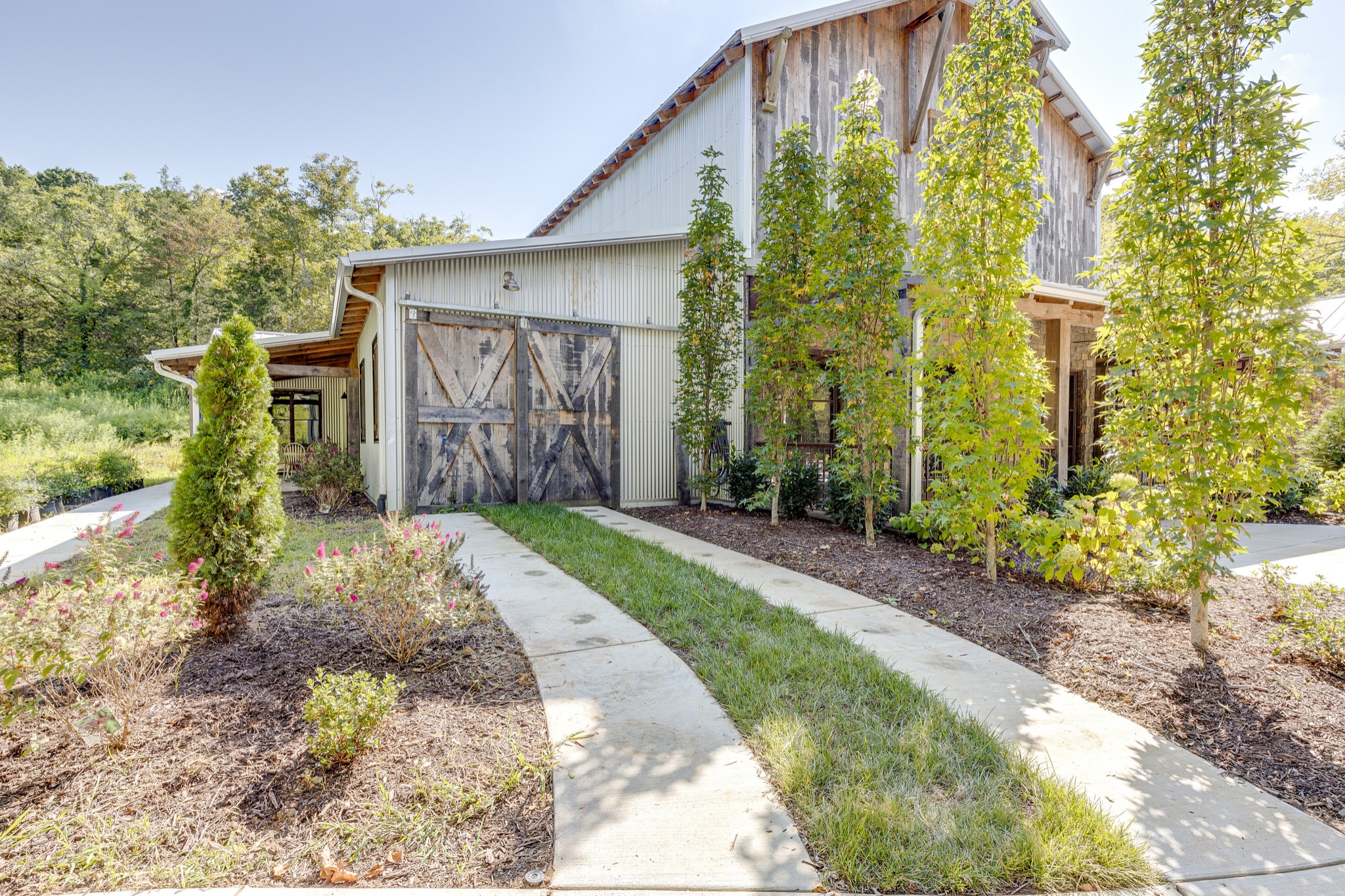 3235 Boyd Mill Pike Franklin, TN 37064 - Photo 35 of 68 The large wood door leads to the workshop area that is heated / cooled.