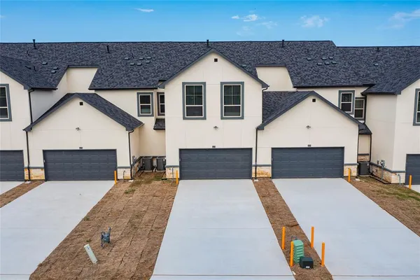 a front view of a house with yard