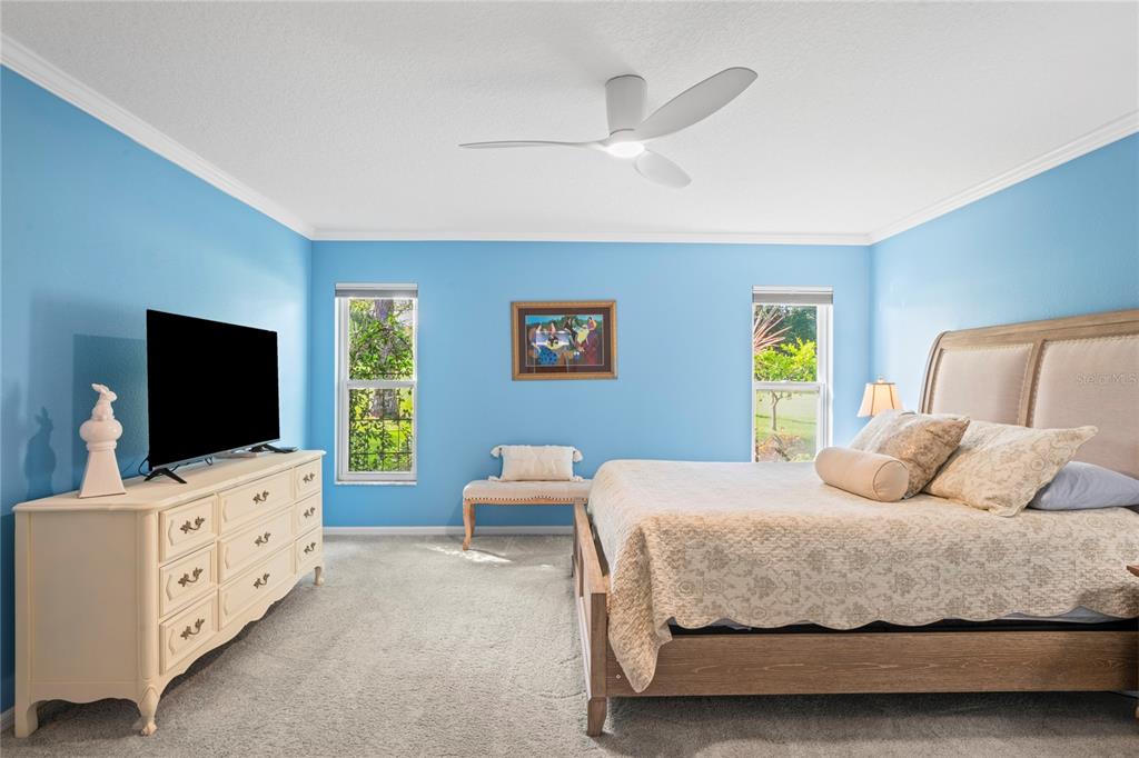 7112 Green Abbey Way Spring Hill, FL 34606 - Photo 22 of 66 a bedroom with a bed and a flat screen tv