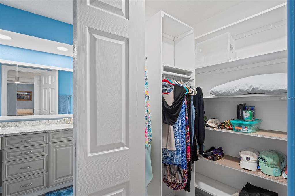 7112 Green Abbey Way Spring Hill, FL 34606 - Photo 25 of 66 a view of walk in closet with clothes and shoes