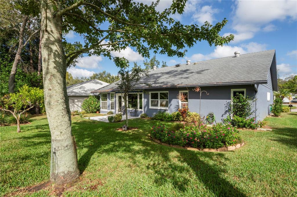 7112 Green Abbey Way Spring Hill, FL 34606 - Photo 38 of 66 a house view with a garden space