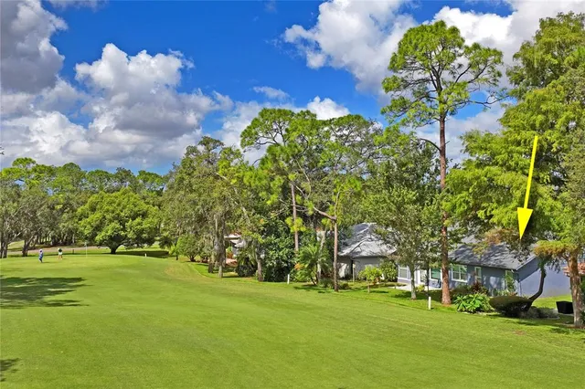 an aerial view of residential house with outdoor space and street view