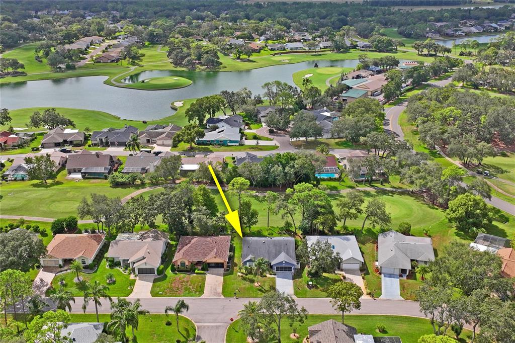 7112 Green Abbey Way Spring Hill, FL 34606 - Photo 58 of 66 a view of lake and houses with outdoor space