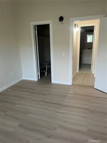 wooden floor and closet in a room