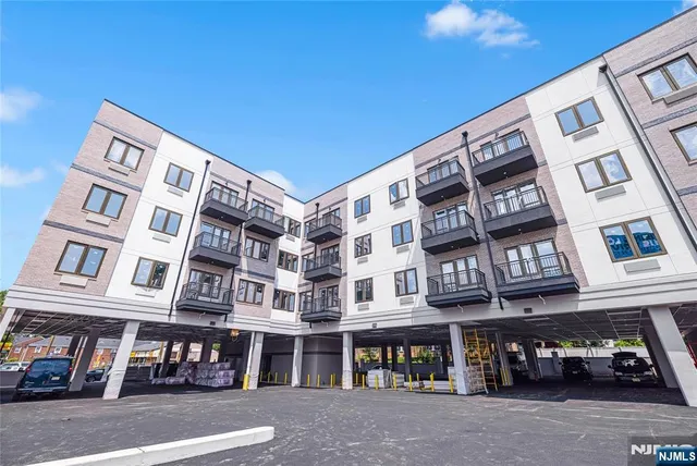a front view of a building with a street