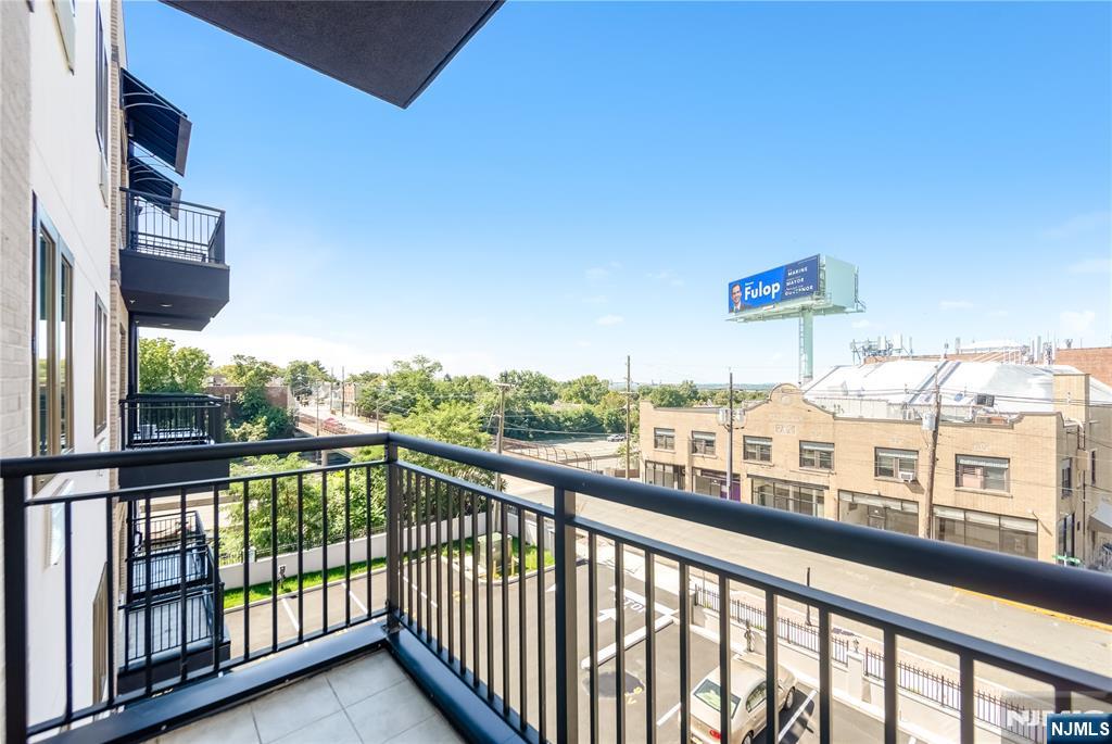 51 Queen Anne Road, Unit 312 Bogota, NJ 07603 - Photo 9 of 23 a view of city from a balcony